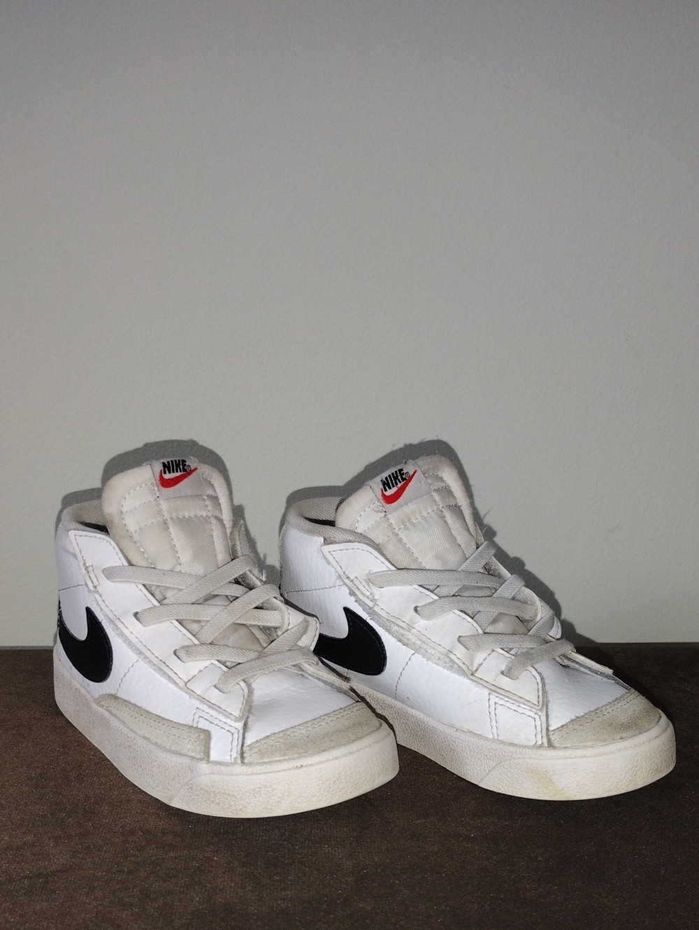 Nike Kids White High-Top Sneakers with Black Swoosh and Red Logo